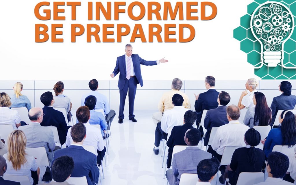 Presenter talks to an audience about reporting commercial real estate for lease.